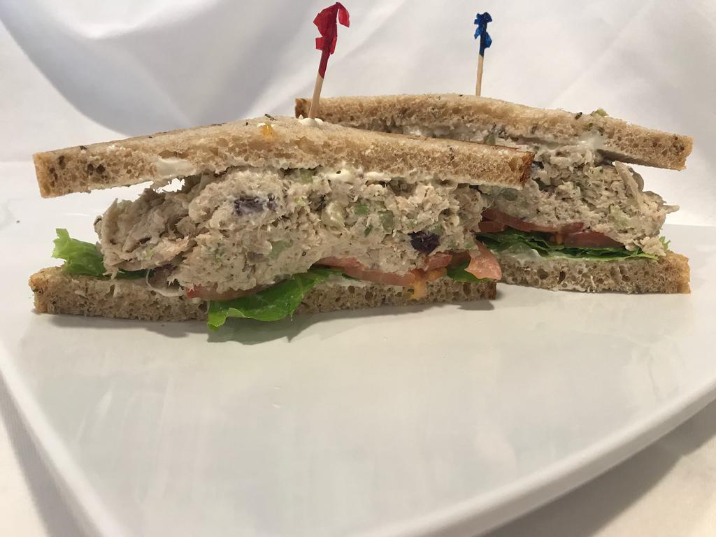 Gourmet House Chicken Salad Sandwich · Our award-winning gourmet chicken salad, cranberries, honey, on your choice of bread with, lettuce, tomato & red onions.