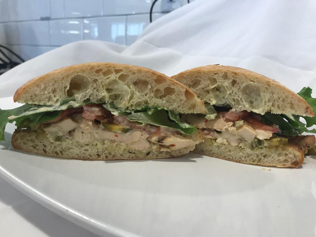 Baja Chicken · Full breast of chicken, jalapeno, melted pepper jack cheese, with chili aioli, lettuce, tomato, grilled onions.