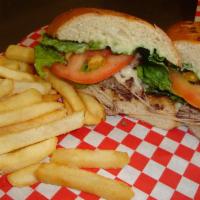 Philly Cheese Steak Sandwich · Beef or chicken, melted provolone cheese with mayo, lettuce, tomato on a sweet roll.