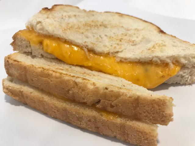 Grilled Cheese Sandwich · Cheddar cheese on sliced sourdough.