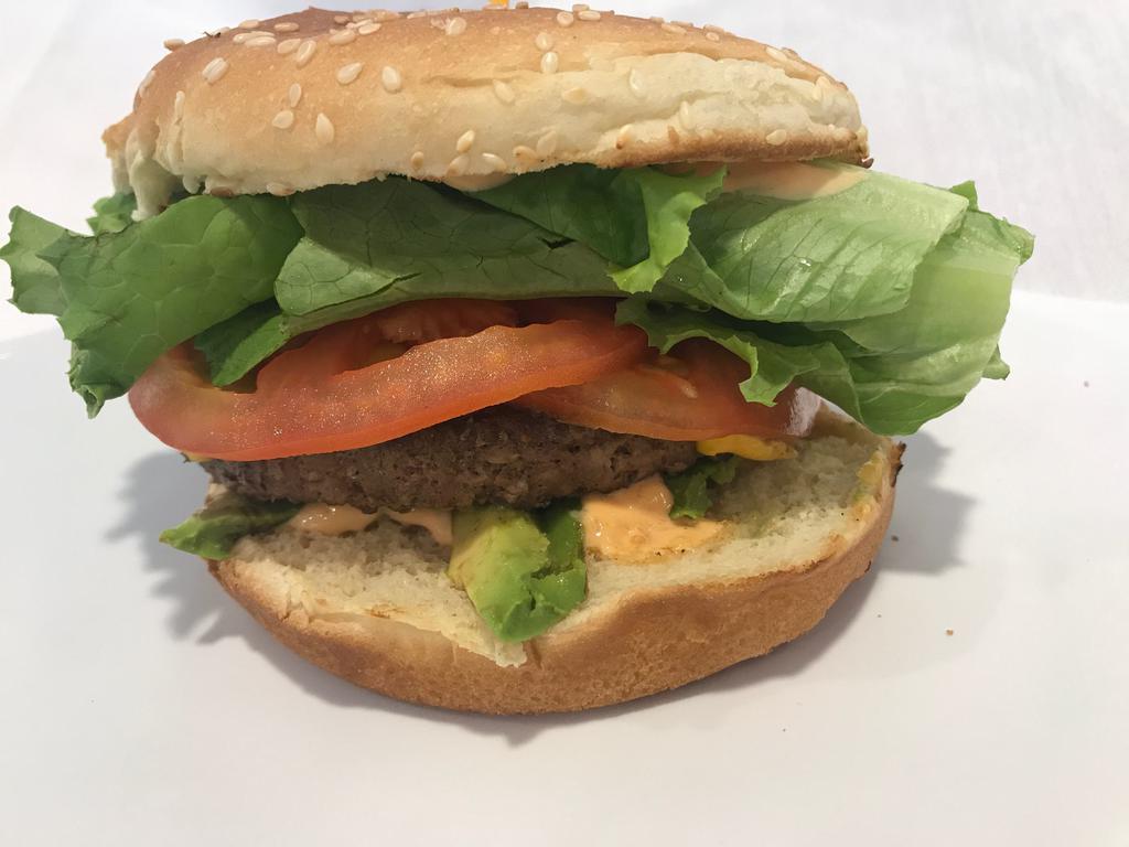 Avocado Burger · All-natural, charbroiled, 100% Black Angus beef, 80/20 1/3 pound patty comes with, our signature sauce, fresh avocado, lettuce, tomato & grilled onions.