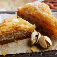 9 Pieces Mini Assortment Baklava · Layers of filo pastry filled with chopped walnuts and topped with simple syrup.
