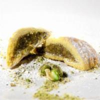 Maamoul with Walnuts · Cookie like, pastry filled with chopped walnuts, sugar and cinnamon, dusted with powdered su...