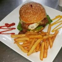 3. La Mia Special Burger · 8oz Beef, cheese, egg, ham, lettuce, tomato, onions, potato sticks,french fries, ketchup, ma...