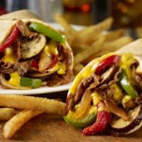 Steak Wrap · 8oz beef steak,Lettuce, tomato, onions, peppers and mushrooms, mayo and french fries