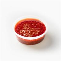 Daddy sauce (Mix garlic butter & cajun) · Served in an 8oz container
