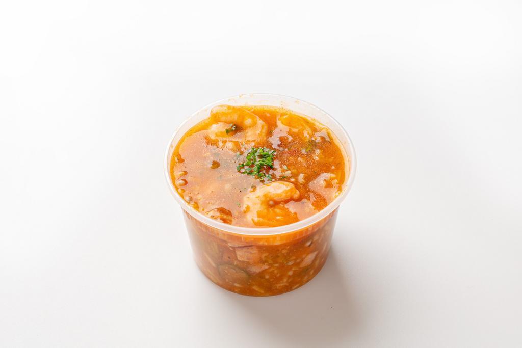Louisiana gumbo with rice · Delicious Louisiana style gumbo soup! Shrimp, chicken, pork sausage, celery, okra, diced tomatoes, red bell peppers, rice, parsley