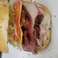 The Bacon Big Schott! · Ham, roast beef, turkey breast, salami, colby cheese, lettuce, and tomato on an onion bun wi...
