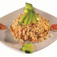43. Tostada de Camaron · Chopped shrimp tanned in Lemon, scrambled with Tomato, Cucumber, Onion and Minced Cilantro, ...