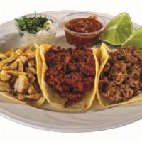 4. Tacos de Chorizo (3) · Grilled White Tortilla stuffed with Chorizo, served with Cilantro, Onion, Lemon and Red Sauc...