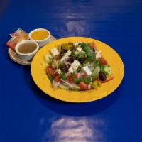 Greek Athenian Salad · Mixed crispy greens, feta cheese, onions, green peppers Greek olives and tomato wedges serve...