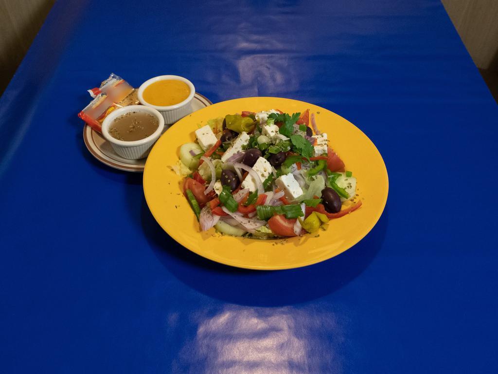 Greek Athenian Salad · Mixed crispy greens, feta cheese, onions, green peppers Greek olives and tomato wedges served with Greek dressing.