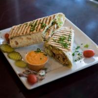 Chicken Shawarma Wrap · Marinated chicken breast thinly sliced, hummus, lettuce, tahini sauce and salad.
