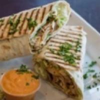 Chicken Kebab Wrap · Marinated grilled chicken breast cubes, hummus, lettuce, tahini sauce and salad.