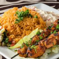 Chicken Kebab Plate · Grilled seasoned chicken breast cubes served with salad, hummus and rice.