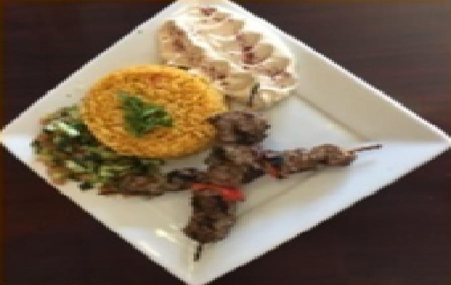 Lamb Kebab Plate · Grilled seasoned lamb cubes served with salad, hummus and rice.