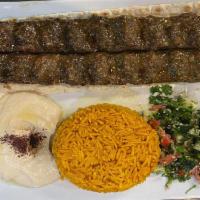 Kofta Kebab Plate · Grilled seasoned ground beef and lamb served with salad, hummus and rice