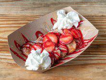 Sophisticated Strawberry Shortcake Pancake · Strawberries, creamy white chocolate, strawberry glaze, and whipped cream.