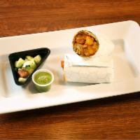 Chicken Tikka Masala Wrap · Naan rolled with chicken tikka, fresh onions, tomatoes, and cilantro. Served with a choice o...