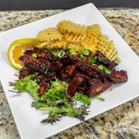 Riblets	 · 1 lb. of tender riblets glazed with barbeque sauce. Served with your choice of a side.