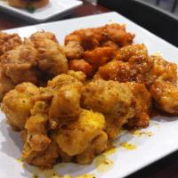 Vegan Wings · Battered and fried cauliflower dipped in your choice or sauce. Regular, lemon pepper, Buffal...