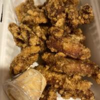 Crispy Chicken Wings · Crispy fried chicken wings seasoned with Tanaka's original chili seasoning.