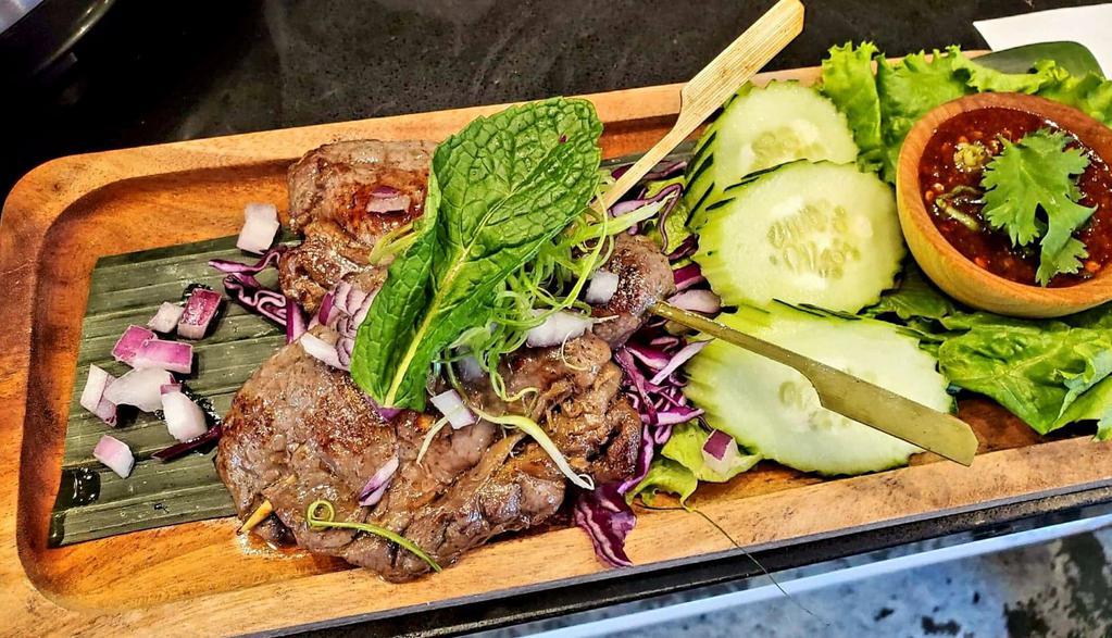 Ribeye Skewer · Ribeye steak marinated with Thai herbs served with spicy tamarind sauce. 
