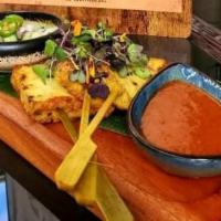Tofu Satay · Grilled tofu marinated in coconut milk & turmeric served with peanut sauce and sweet pickle ...