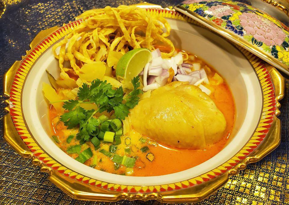 Khao Soi Chicken · Yellow curry noodle soup served with chicken drumstick.