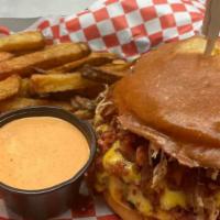 Triple Meat Melt · A burger patty topped with American and Gouda cheese, stacked high with grilled chicken, bac...