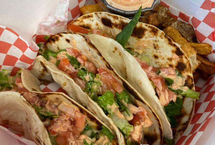 Street Tacos · 3 pieces. Flour tortillas stuffed with grilled chicken, lettuce, tomato, and topped with Z-sauce.