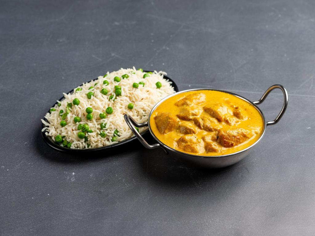 Chicken Coconut Korma · Boneless chicken cooked with coconut milk, onion, tomatoes, cashew nuts and spices. Served with basmati rice.