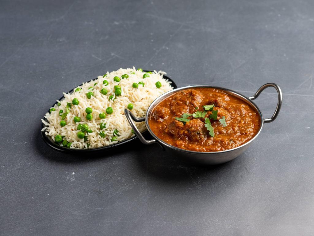 Lamb Vindaloo · Lamb cooked in hot spices in a highly seasoned gravy of potatoes, tomatoes and chili pepper. Served with basmati rice.