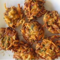Vegetable Pakoras · Six mixed vegetable fritters. Served with basmati rice and your choice of mild, medium or hot.