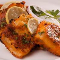 Fish Pakora  · Lightly battered fish fry in harbs & spices. Served crunchy and light.