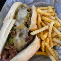 Philly Cheesesteak Sandwich · Roast beef with melted provolone, garlic, sautéed onions and green pepper served on a hoagie...
