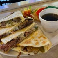 Steak Quesadilla · Grilled Steak baked with melted cheeses folded inside a fresh tortilla and served with a tor...