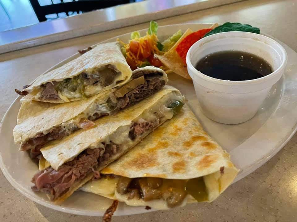Steak Quesadilla · Grilled Steak baked with melted cheeses folded inside a fresh tortilla and served with a tortilla chips, salsa and sour cream