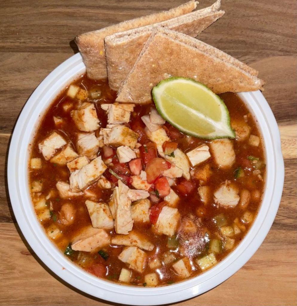 Chicken Chili · Chicken breast chunks with pinto beans and veggies in a seasoned tomato broth. When life keeps you busy this is nutrition on the go! Just heat and eat.