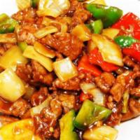 55. Pepper Steak with Onions · Served with rice.