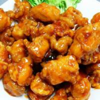 L22. Orange Chicken Dinner · Served with egg roll and pork fried rice. Hot and spicy.