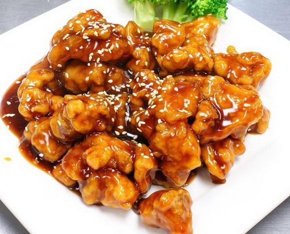 4. Sesame Chicken Chef's Suggestion · Chunks of chicken dipped in lotus flour, fried and cooked in sesame sauce. Served with white rice. 
