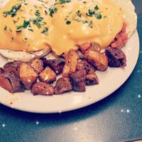 Grace’s Portuguese Benedict · Our scratch-made Portuguese chourico and peppers on a grilled bolo topped with 2 poached egg...