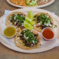 Taco Pastor · Marinated Pork served with onion, cilantro and Pineapple.