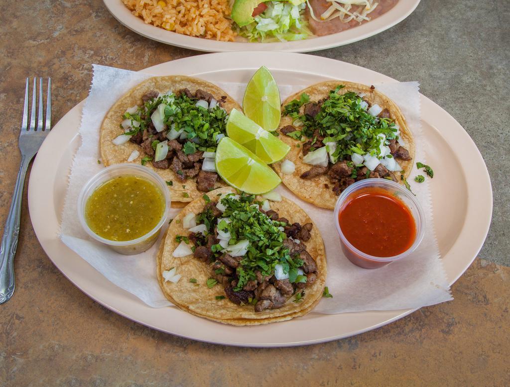 Taco Pastor · Marinated Pork served with onion, cilantro and Pineapple.