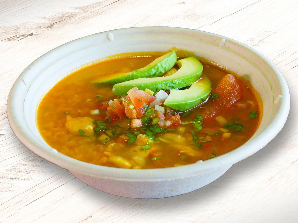 Catrina Chicken Soup · A blend of chicken broth filled with pulled white meat chicken rice, pico de gallo, and a slice of avocado.