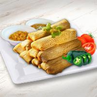 Tamales Family Pack · 12 Pork Tamales. Served with sour cream, onions, cilantro, salsa choice, served with a side ...