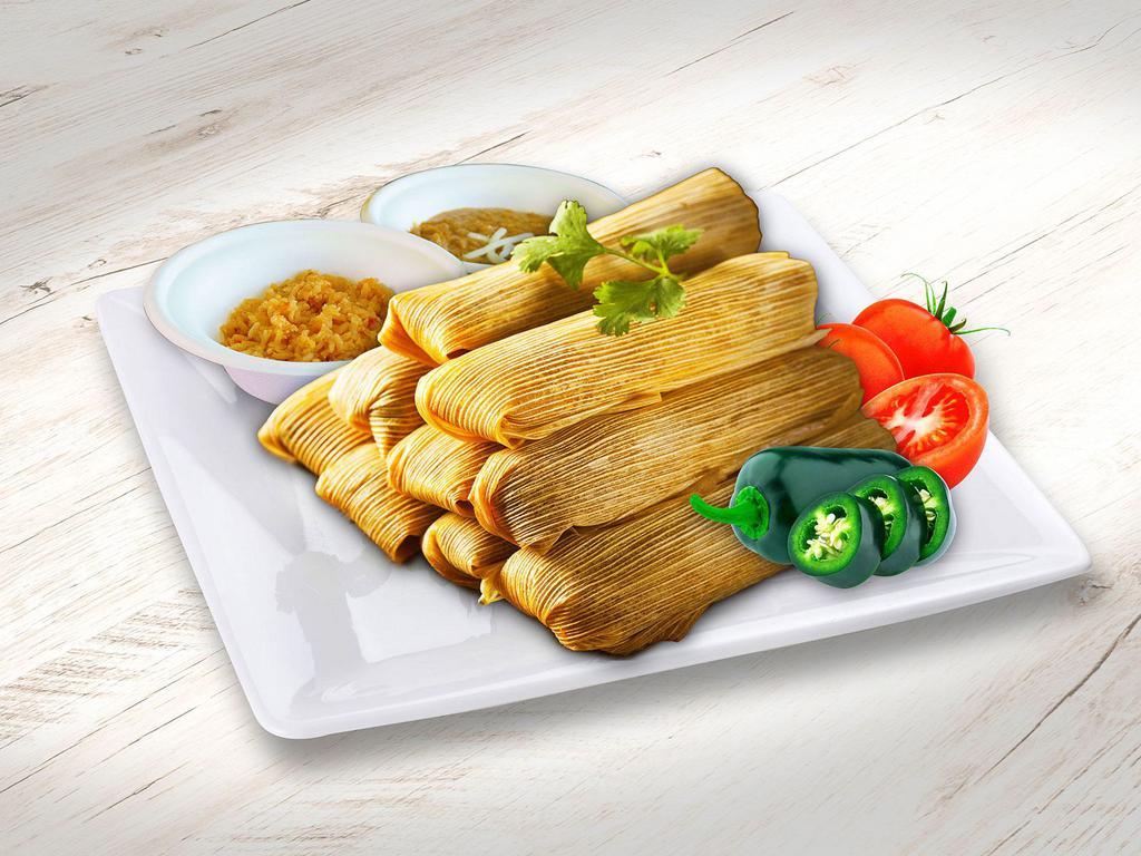 Tamales Family Pack · 12 Pork Tamales. Served with sour cream, onions, cilantro, salsa choice, served with a side of Mexican rice and Refried Beans, 8oz salsa and chips.
