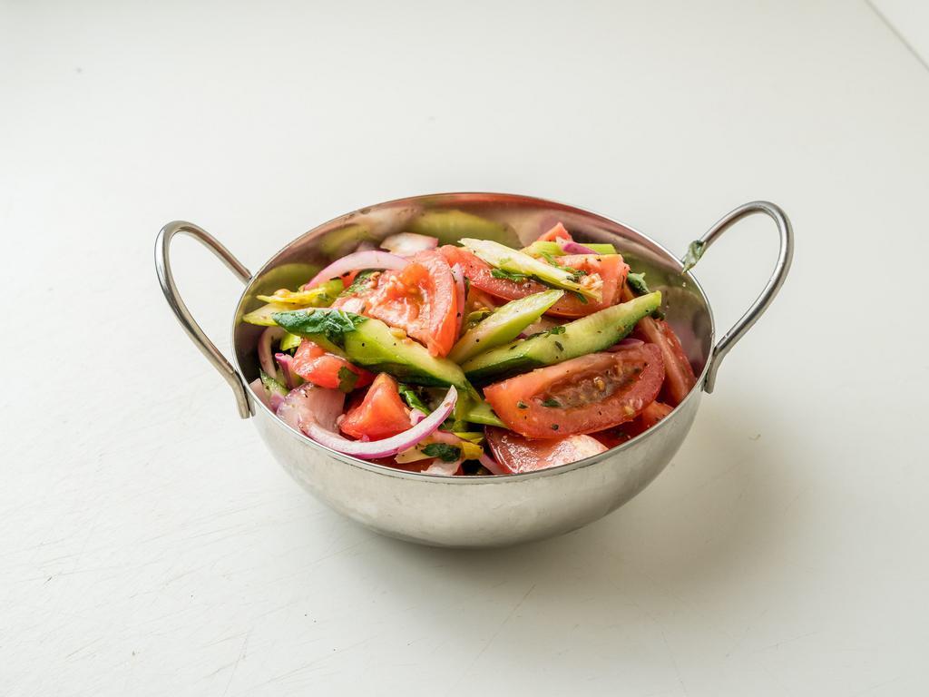 Tomato Cucumber Salad · Vine ripe plum tomatoes, hot house cucumber, celery leaf, red onion and red wine vinaigrette.