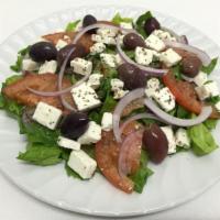 Greek Salad · Lettuce, tomatoes and onions topped with feta cheese and olives drizzled with our house dres...